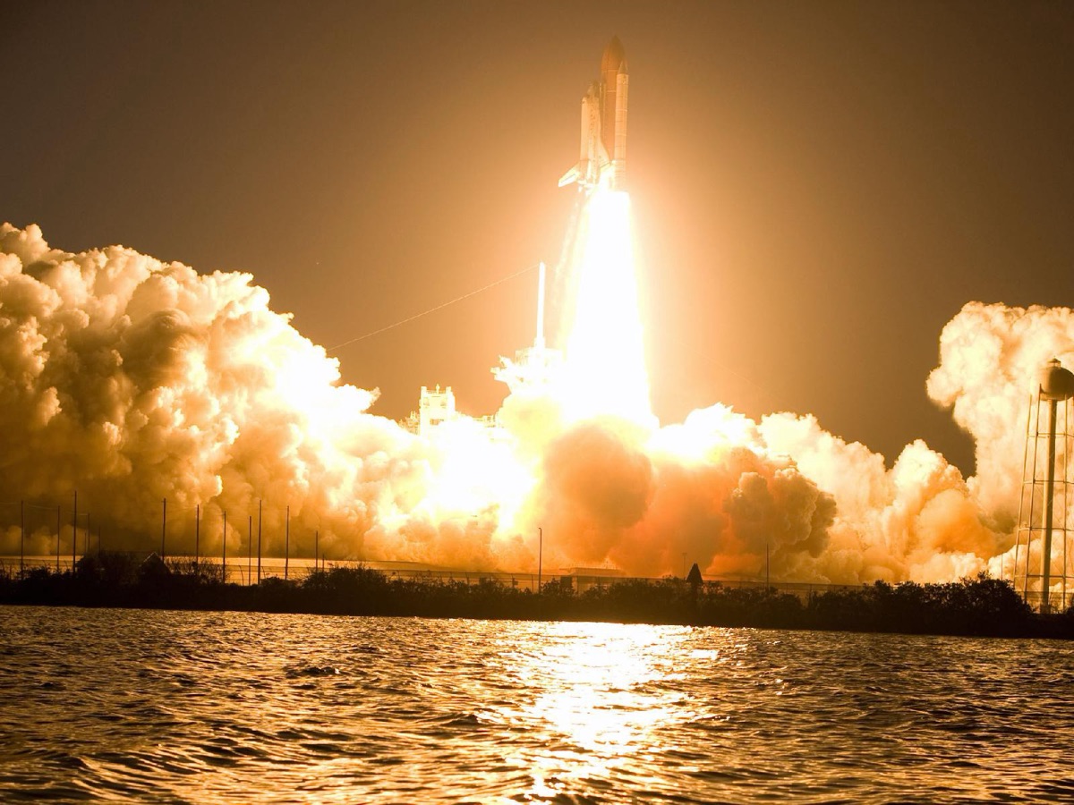 A space shuttle launch at night, from Tracey’s original Escape Velocity essay